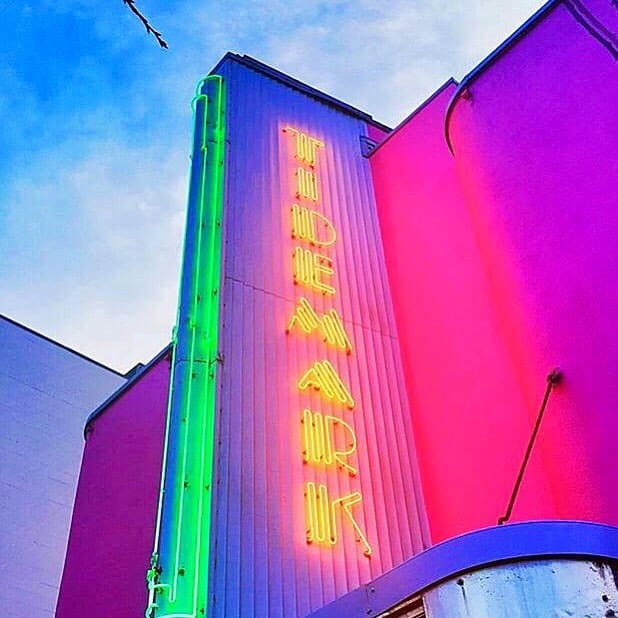 The illuminated Tidemark Theatre sign above the entrance in Campbell River